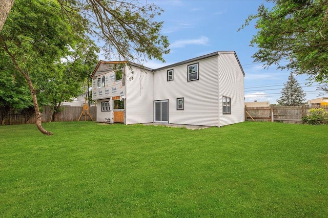 130 E Carmans Rd, Farmingdale, NY 11735 - rear view of house with a fenced backyard