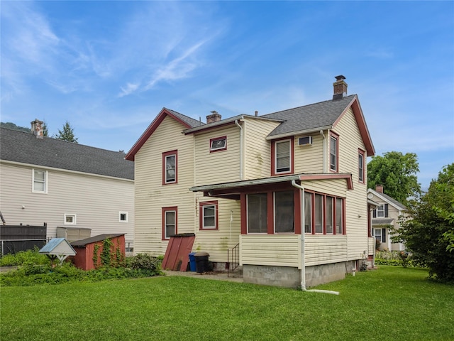 10 Vail Ave, Beacon, NY 12508 - back of house with a chimney, a lawn, and a sunroom