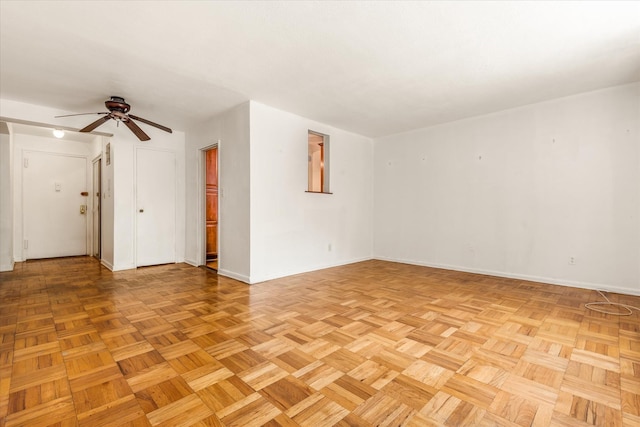 89-40 151st Ave Unit 1M, Howard Beach, NY 11414 - unfurnished room featuring baseboards and ceiling fan