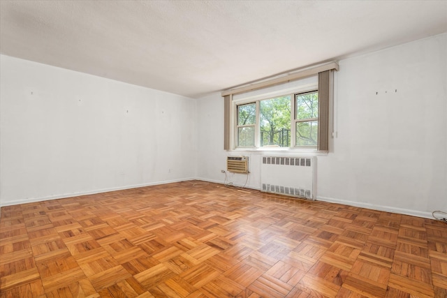 89-40 151st Ave Unit 1M, Howard Beach, NY 11414 - unfurnished room with radiator and a wall unit AC