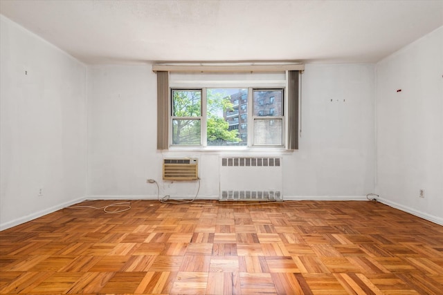 89-40 151st Ave Unit 1M, Howard Beach, NY 11414 - unfurnished room featuring radiator and an AC wall unit