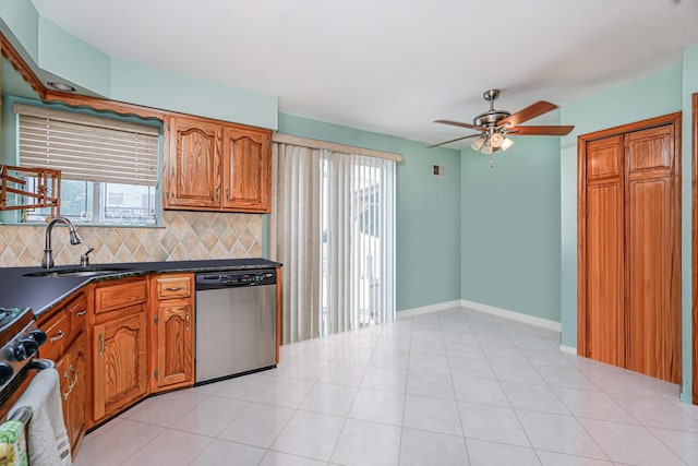 127 Keating Pl, Staten Island, NY 10314 - kitchen featuring dishwasher, a ceiling fan, dark countertops, decorative backsplash, and brown cabinetry