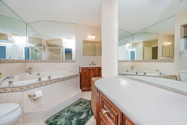 127 Keating Pl, Staten Island, NY 10314 - bathroom featuring tile walls, a garden tub, tile patterned flooring, vanity, and a shower stall