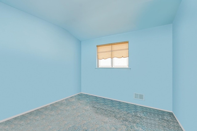 127 Keating Pl, Staten Island, NY 10314 - spare room featuring carpet and lofted ceiling