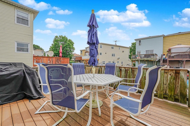 127 Keating Pl, Staten Island, NY 10314 - wooden deck featuring grilling area and outdoor dining area