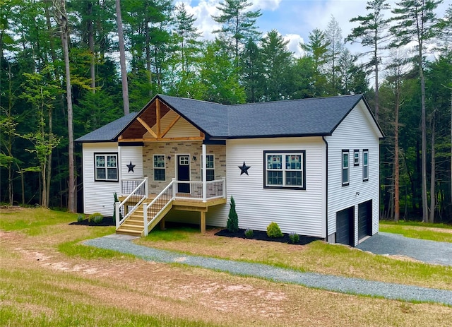 109 Krystyna Rd, White Lake, NY 12787 - view of front of property featuring a garage, gravel driveway, covered porch, a shingled roof, and a front yard