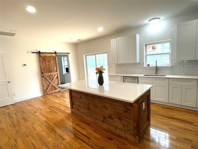 109 Krystyna Rd, White Lake, NY 12787 - kitchen with a barn door, decorative backsplash, light wood-style flooring, healthy amount of natural light, and recessed lighting