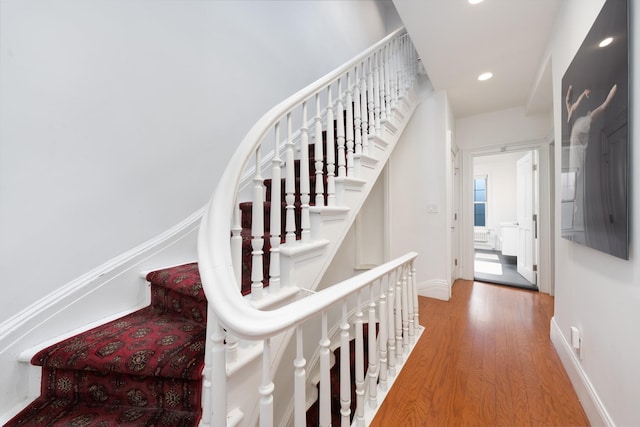 17E 128th St, New York Manhattan, NY 10035 - staircase featuring wood finished floors and recessed lighting