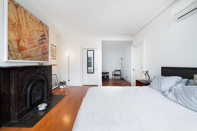 17E 128th St, New York Manhattan, NY 10035 - bedroom featuring a wall mounted air conditioner, crown molding, and wood finished floors