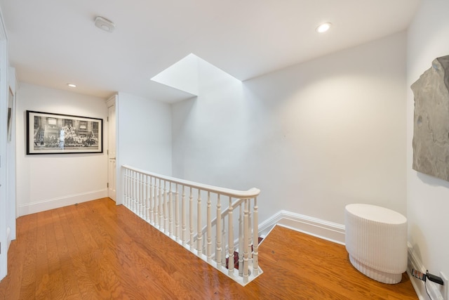17E 128th St, New York Manhattan, NY 10035 - hallway featuring an upstairs landing, wood finished floors, and recessed lighting