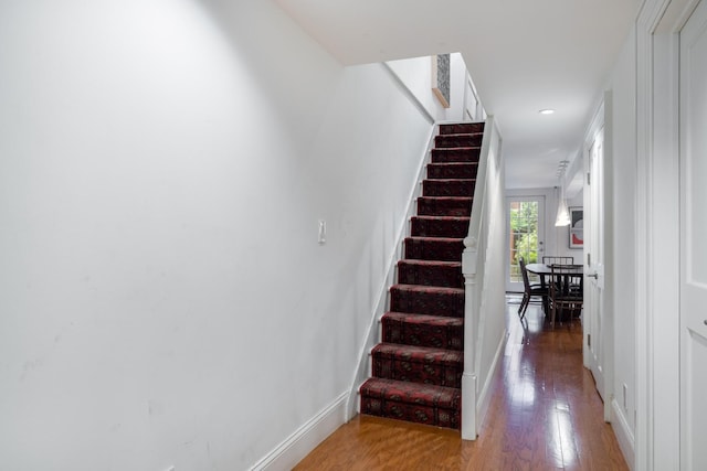 17E 128th St, New York Manhattan, NY 10035 - staircase featuring hardwood / wood-style flooring and recessed lighting