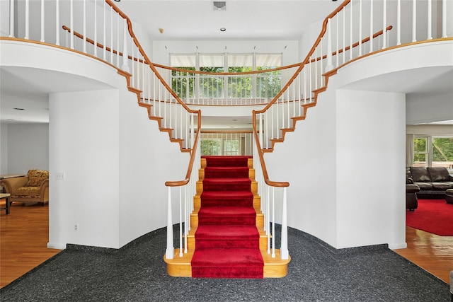 14 Pheasant Hill Ln, Old Brookville, NY 11545 - stairs featuring wood finished floors and a towering ceiling