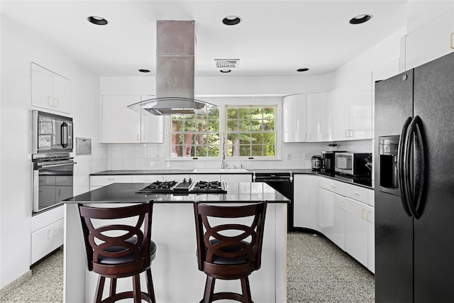 14 Pheasant Hill Ln, Old Brookville, NY 11545 - kitchen featuring black appliances, dark countertops, white cabinets, a center island, and recessed lighting