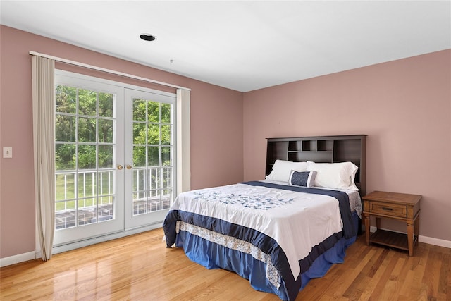 14 Pheasant Hill Ln, Old Brookville, NY 11545 - bedroom with french doors, access to exterior, and wood finished floors