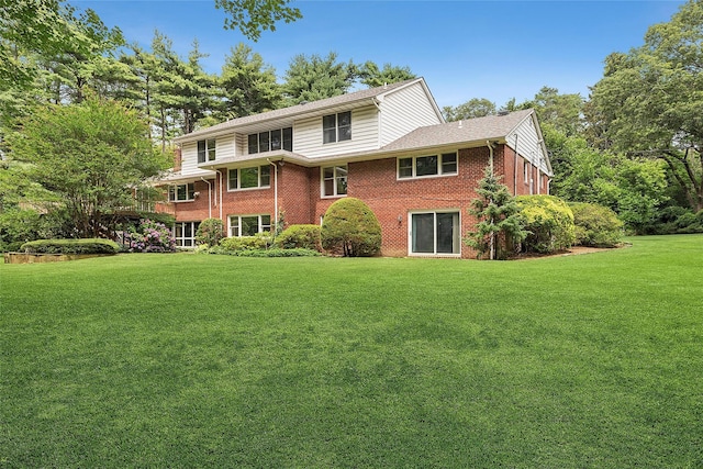 14 Pheasant Hill Ln, Old Brookville, NY 11545 - back of house featuring brick siding and a lawn