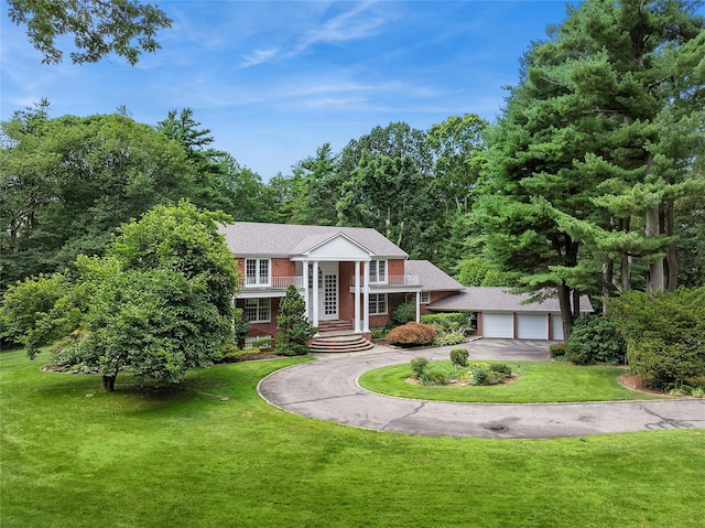 14 Pheasant Hill Ln, Old Brookville, NY 11545 - greek revival house featuring a front yard and brick siding