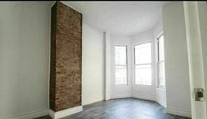 130 W 165th St, Bronx, NY 10452 - spare room with baseboards