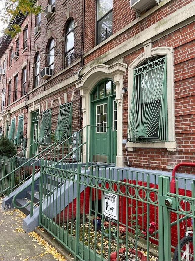 1047 Faile St Unit 1047A, Bronx, NY 10459 - entrance to property featuring brick siding and cooling unit