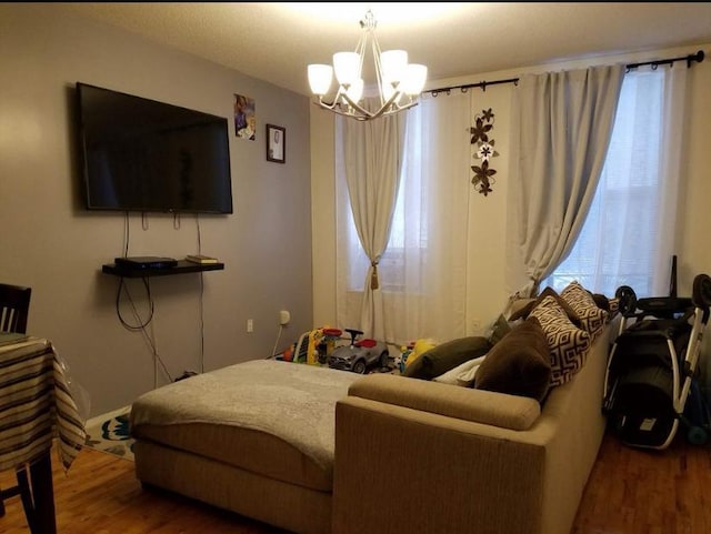 1047 Faile St Unit 1047A, Bronx, NY 10459 - living room with wood finished floors and a chandelier