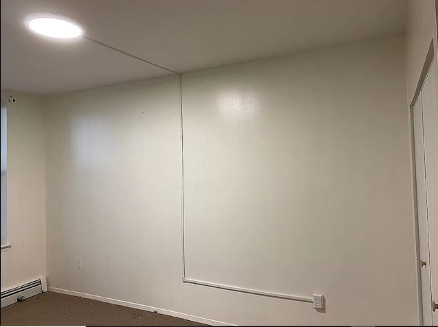 1047 Faile St Unit 1047A, Bronx, NY 10459 - spare room featuring a baseboard heating unit and baseboards