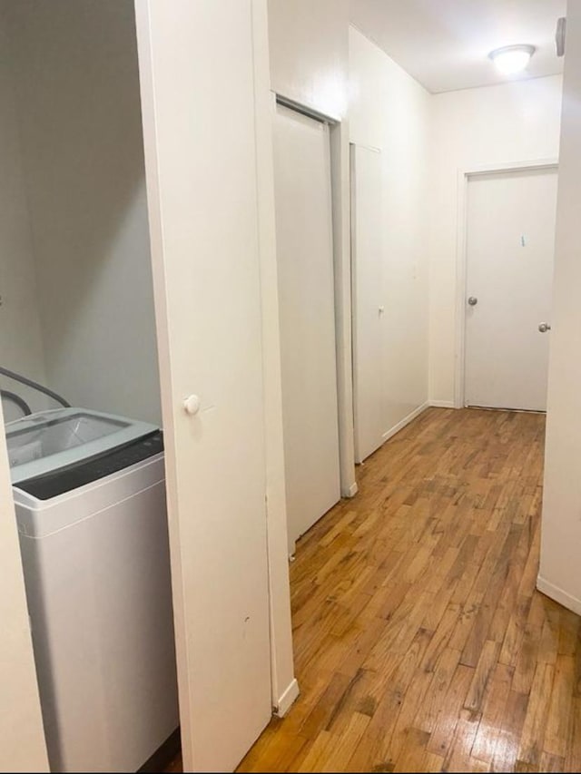 1047 Faile St Unit 1047A, Bronx, NY 10459 - laundry room featuring light wood-style floors and washer / dryer