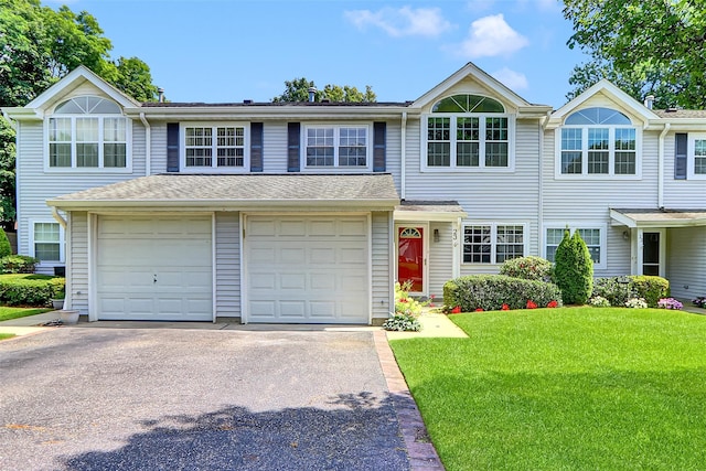 23 Indian Trce, Kings Park, NY 11754 - traditional-style home with driveway, a front lawn, and an attached garage