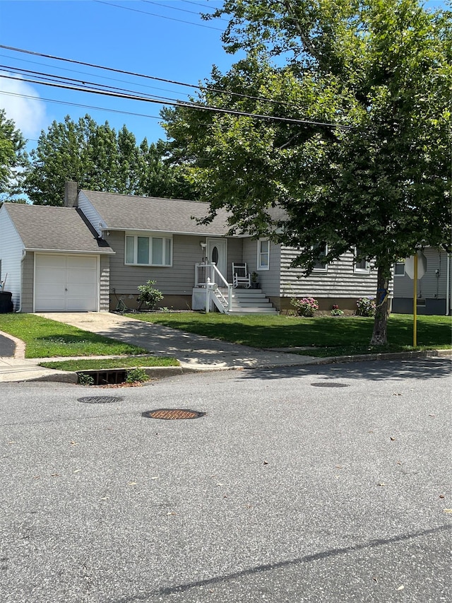 19 Tappan Ave, Babylon, NY 11702 - view of front of house featuring an attached garage and driveway