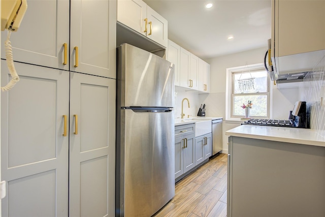 144-60 Gravett Rd Unit 4J, Kew Garden Hills, NY 11367 - kitchen featuring stainless steel appliances, light countertops, recessed lighting, light wood-type flooring, and decorative backsplash
