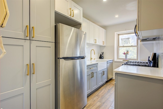 144-60 Gravett Rd Unit 4J, Kew Garden Hills, NY 11367 - kitchen featuring appliances with stainless steel finishes, light countertops, light wood-style floors, recessed lighting, and gray cabinetry