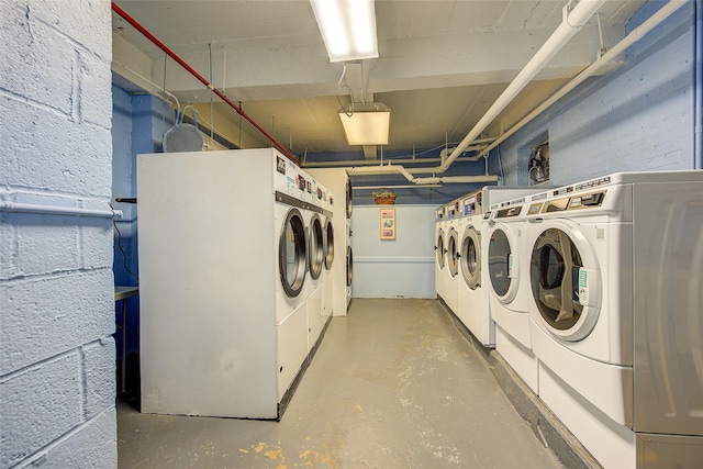 144-60 Gravett Rd Unit 4J, Kew Garden Hills, NY 11367 - community laundry room with washing machine and dryer and concrete block wall