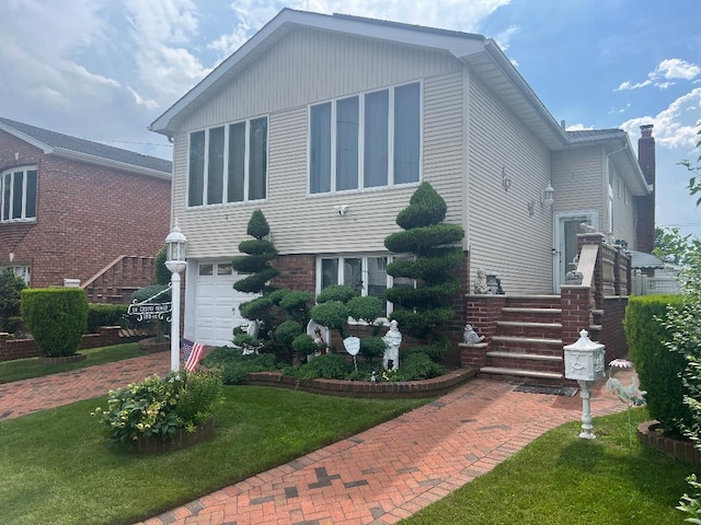 15916 92nd St, Howard Beach, NY 11414 - view of front of home featuring a front lawn and an attached garage