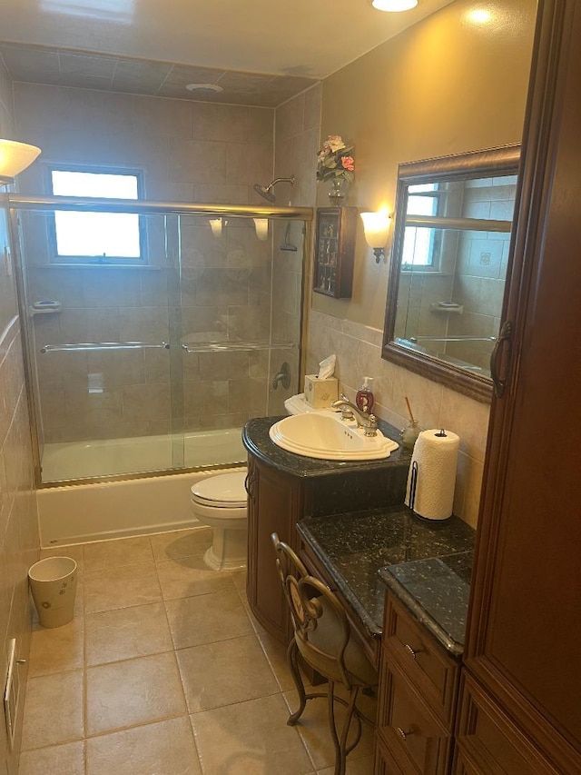 15916 92nd St, Howard Beach, NY 11414 - bathroom with vanity, enclosed tub / shower combo, tile patterned flooring, healthy amount of natural light, and tile walls