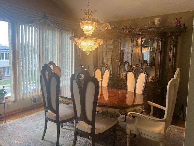 15916 92nd St, Howard Beach, NY 11414 - dining space featuring a chandelier and light wood-style floors