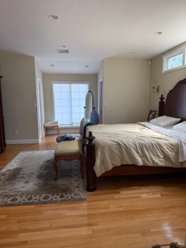 9 Seneca St E, Massapequa, NY 11758 - bedroom featuring light wood-style flooring and recessed lighting