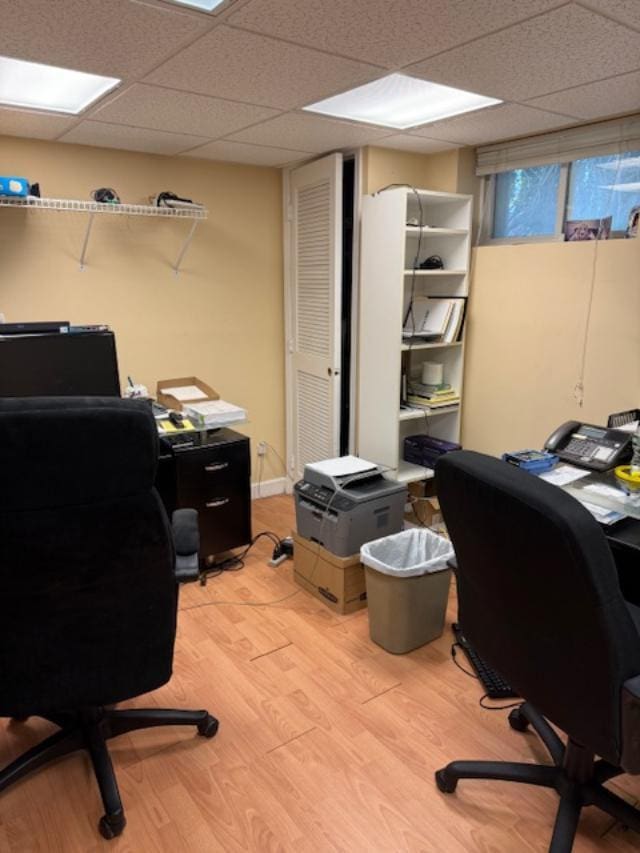 9 Seneca St E, Massapequa, NY 11758 - home office with a paneled ceiling and light wood-type flooring