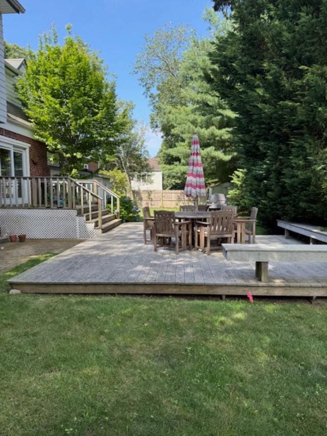9 Seneca St E, Massapequa, NY 11758 - view of green lawn featuring a deck and outdoor dining space