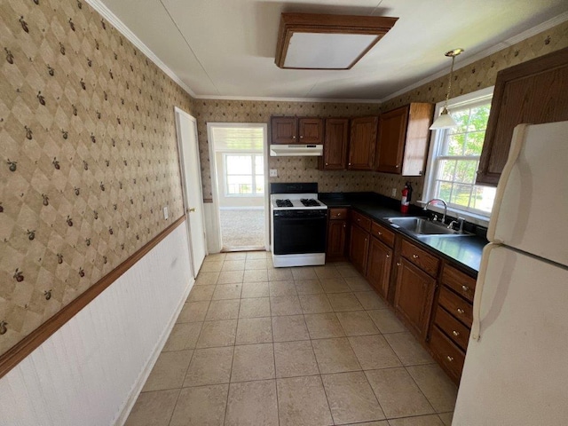 4 Harold St, Port Jervis, NY 12771 - kitchen featuring white appliances, wallpapered walls, under cabinet range hood, crown molding, and dark countertops