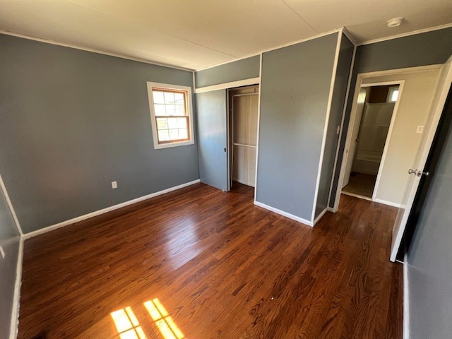 4 Harold St, Port Jervis, NY 12771 - unfurnished bedroom with dark wood finished floors, crown molding, and a closet