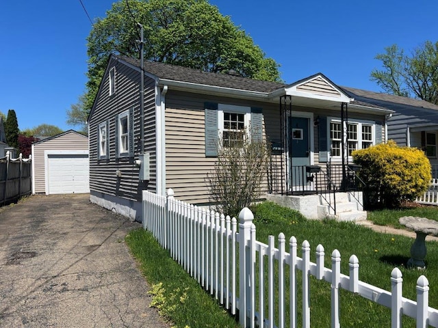 4 Harold St, Port Jervis, NY 12771 - view of front of property featuring an outdoor structure, driveway, and a detached garage