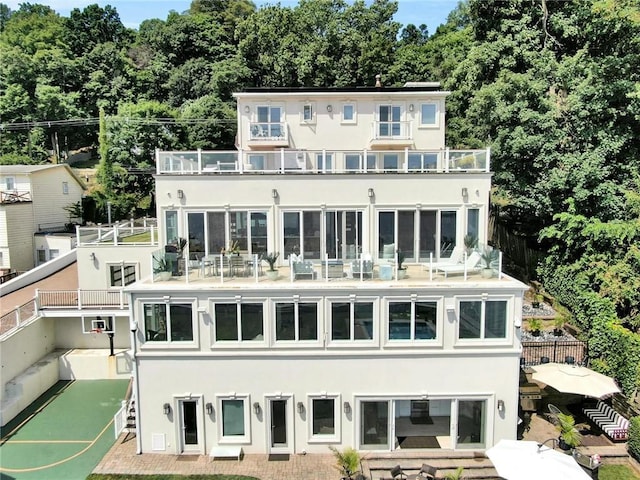 74 River Rd, Nyack, NY 10960 - rear view of house with a balcony and stucco siding