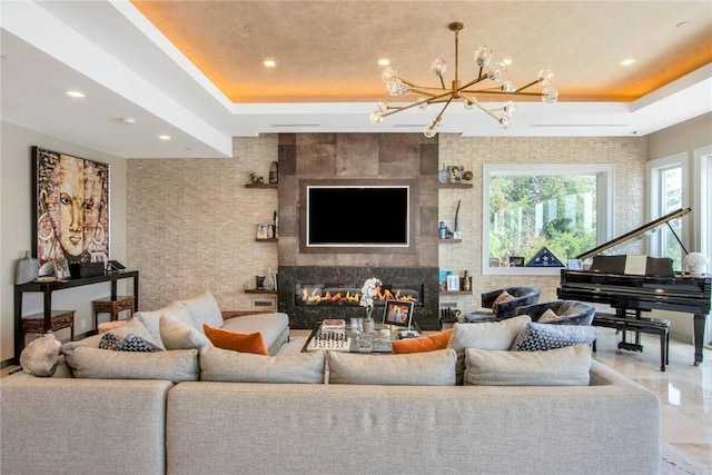 74 River Rd, Nyack, NY 10960 - living area with a raised ceiling, a chandelier, a tile fireplace, and recessed lighting