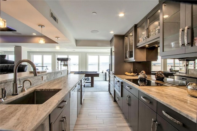 74 River Rd, Nyack, NY 10960 - kitchen with healthy amount of natural light, appliances with stainless steel finishes, light stone counters, and recessed lighting
