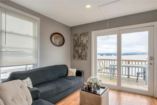 74 River Rd, Nyack, NY 10960 - living area with attic access, plenty of natural light, light wood finished floors, a water view, and recessed lighting