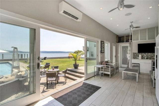 74 River Rd, Nyack, NY 10960 - sunroom featuring a wall mounted air conditioner and ceiling fan