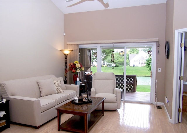 507 Constance Ln, Port Jefferson Station, NY 11776 - living area with high vaulted ceiling, ceiling fan, and light wood finished floors