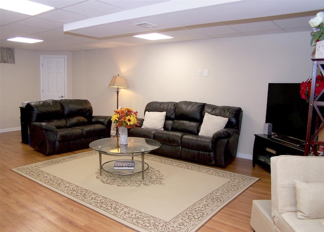 507 Constance Ln, Port Jefferson Station, NY 11776 - living area featuring wood finished floors and a paneled ceiling