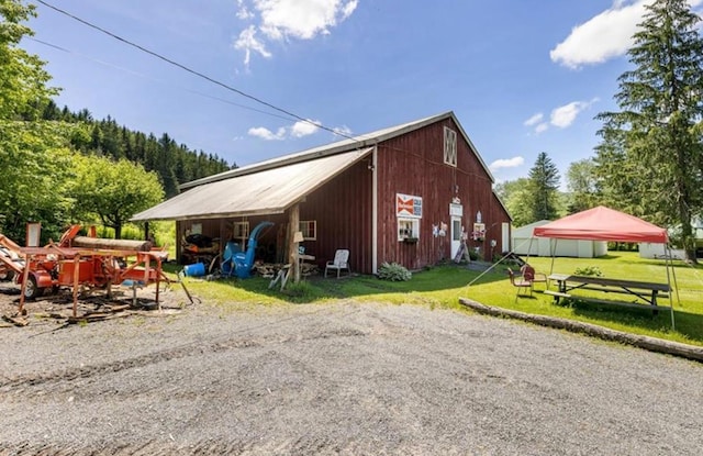 2018 Beaverkill Rd, Livingston Manor, NY 12758 - view of side of home with a yard and an outbuilding