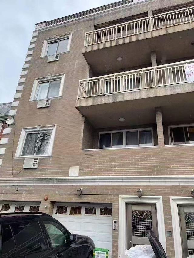 8827 53 Rd Ave Unit 2R, Elmhurst, NY 11373 - view of property with an attached garage