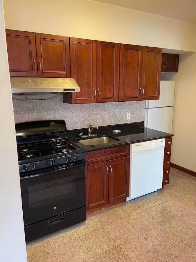 8827 53 Rd Ave Unit 2R, Elmhurst, NY 11373 - kitchen with white appliances, backsplash, under cabinet range hood, and dark countertops