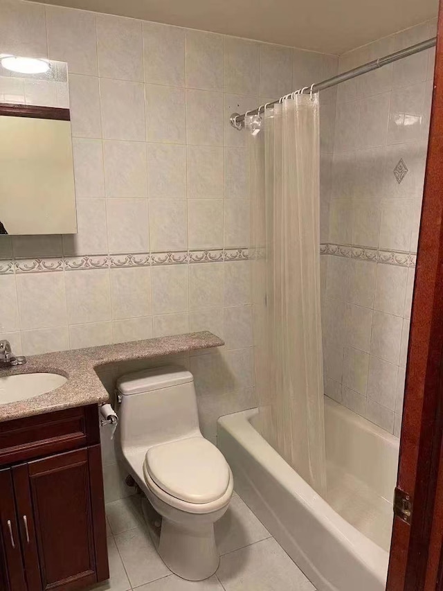 8827 53 Rd Ave Unit 2R, Elmhurst, NY 11373 - bathroom featuring tile patterned floors, tile walls, shower / tub combo with curtain, vanity, and decorative backsplash